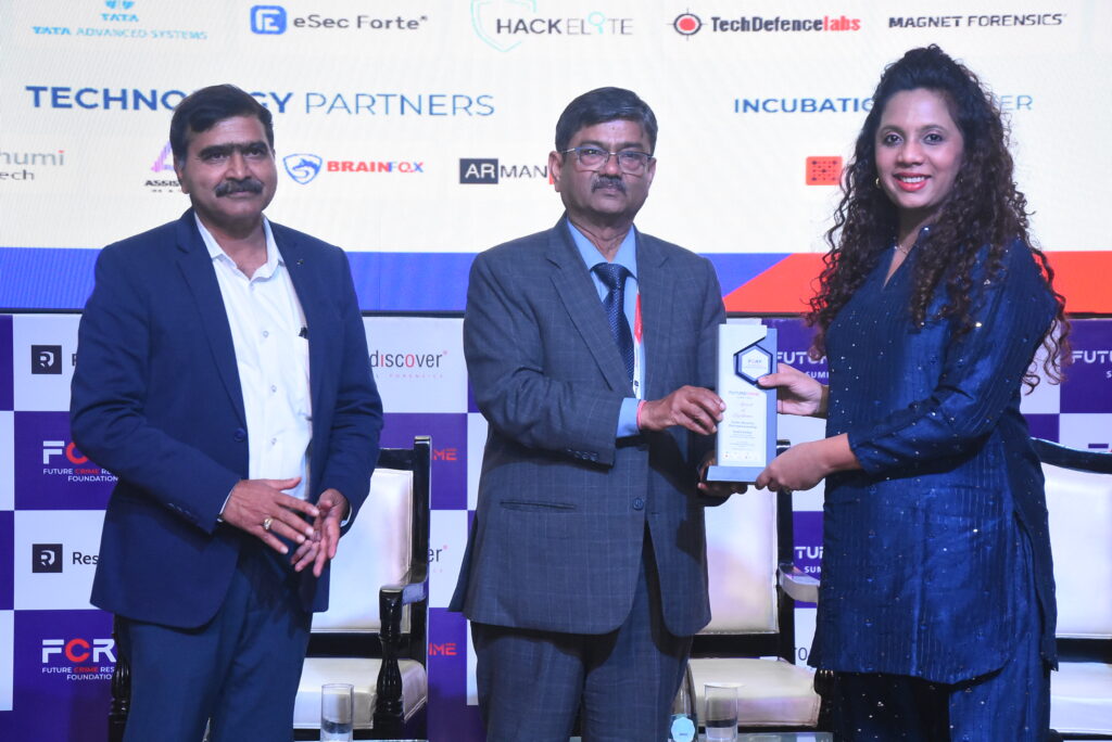 Sneha Katkar receiving her award at FutureCrime Summit 2025.