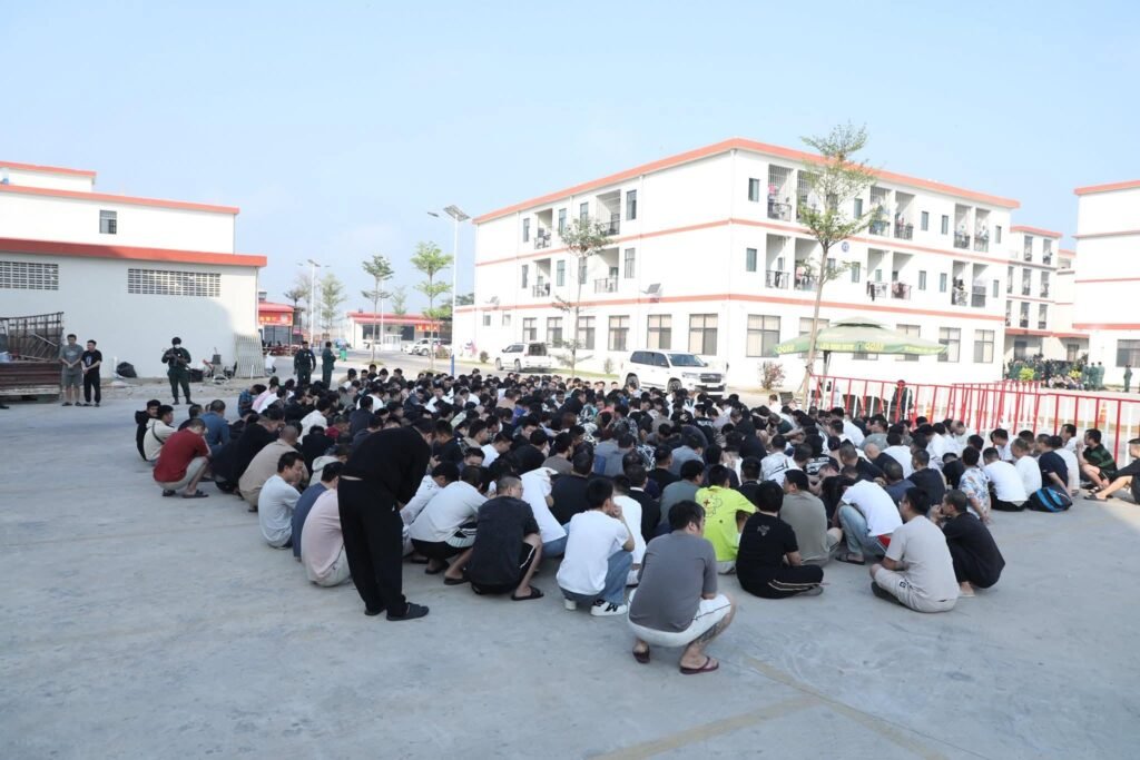 Hundreds of detainees assembled under police supervision inside the compound as authorities conducted identity checks following the multi-agency crackdown.